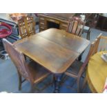 An early 20th century oak dining table with extra leaf, 29" h x 59"w (extended) and four dining