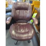 A modern aubergine leather upholstered office chair