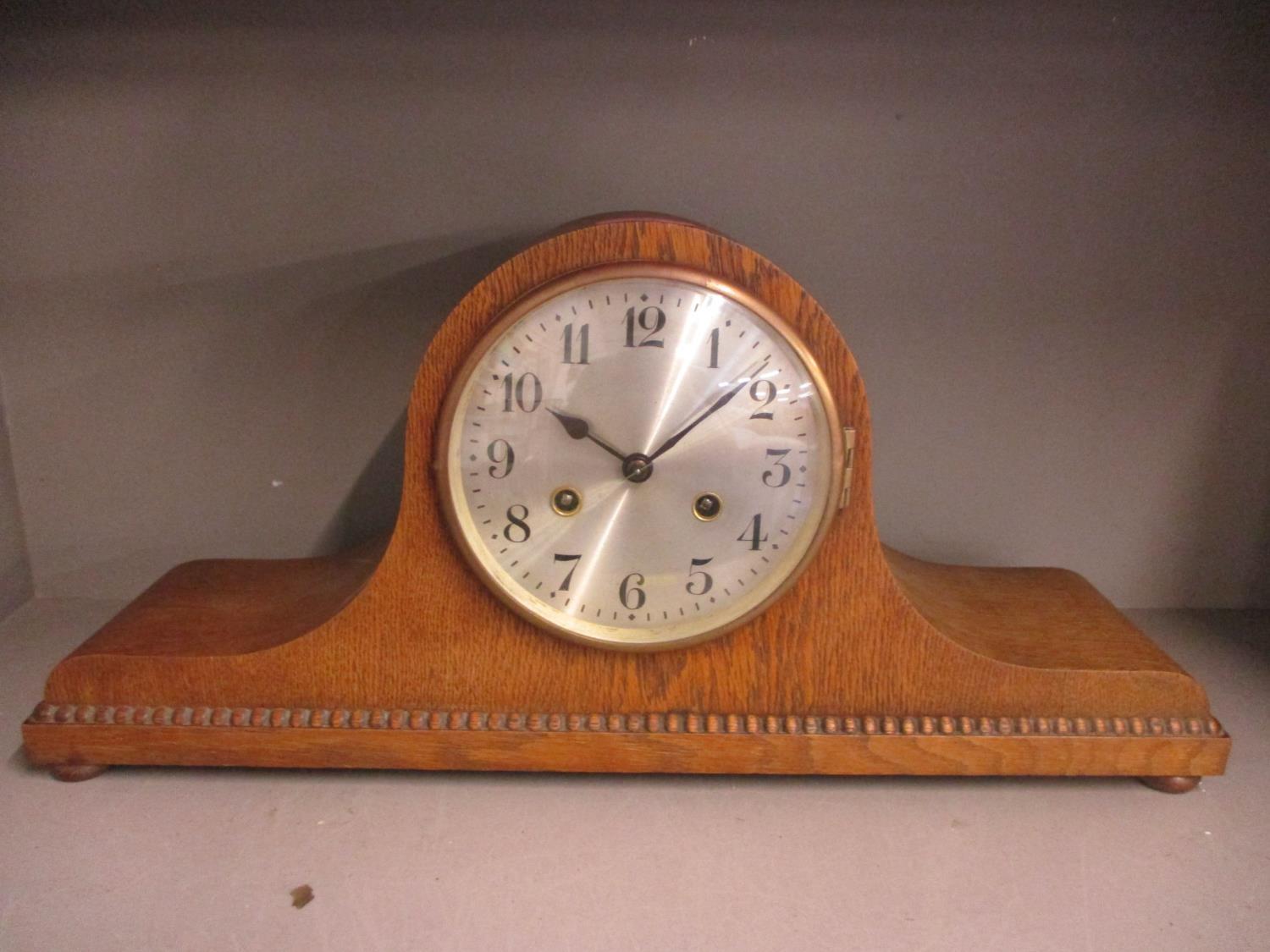 An early 20th century oak cased, 8 day mantle clock