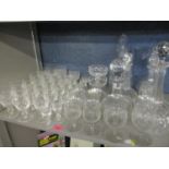 A quantity of Waterford lead crystal glasses, together with early 20th century decanters, etched