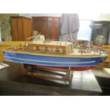 A large Scraton built electric model of boat on a stand 19 1/2"h x 43 1/2"w