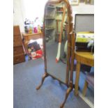 An early 20th century walnut cheval mirror