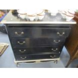A modern black lacquered chest of four long drawers with silver painted highlights, 38" h x 36" w,