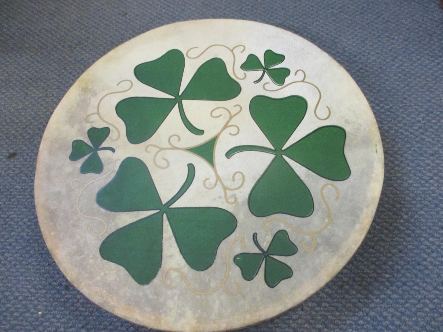 A vintage Irish shallow drum and a wooden hobby horse