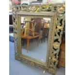 An ornate Flemish green and gilt wall mirror 44" x 36"