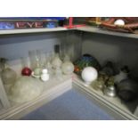 A quantity of oil lamp and table parts to include glass reservoirs and shades