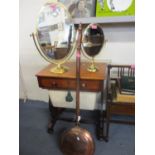 Two modern brass framed swivel mirrors, together with a Victorian copper warming pan