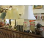 Four late 20th century table lamps, together with a Victorian oil lamp with two glass funnels, tow