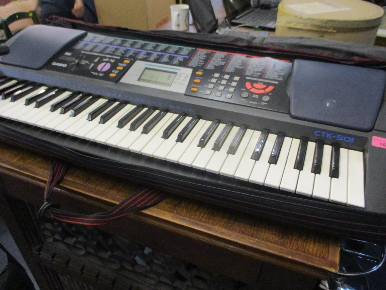 A Casio CTK 502 keyboard with microphone stand - Image 2 of 2