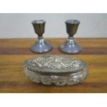 A pair of Elizabeth II dwarf candlesticks and an early 20th century silver topped and cut glass