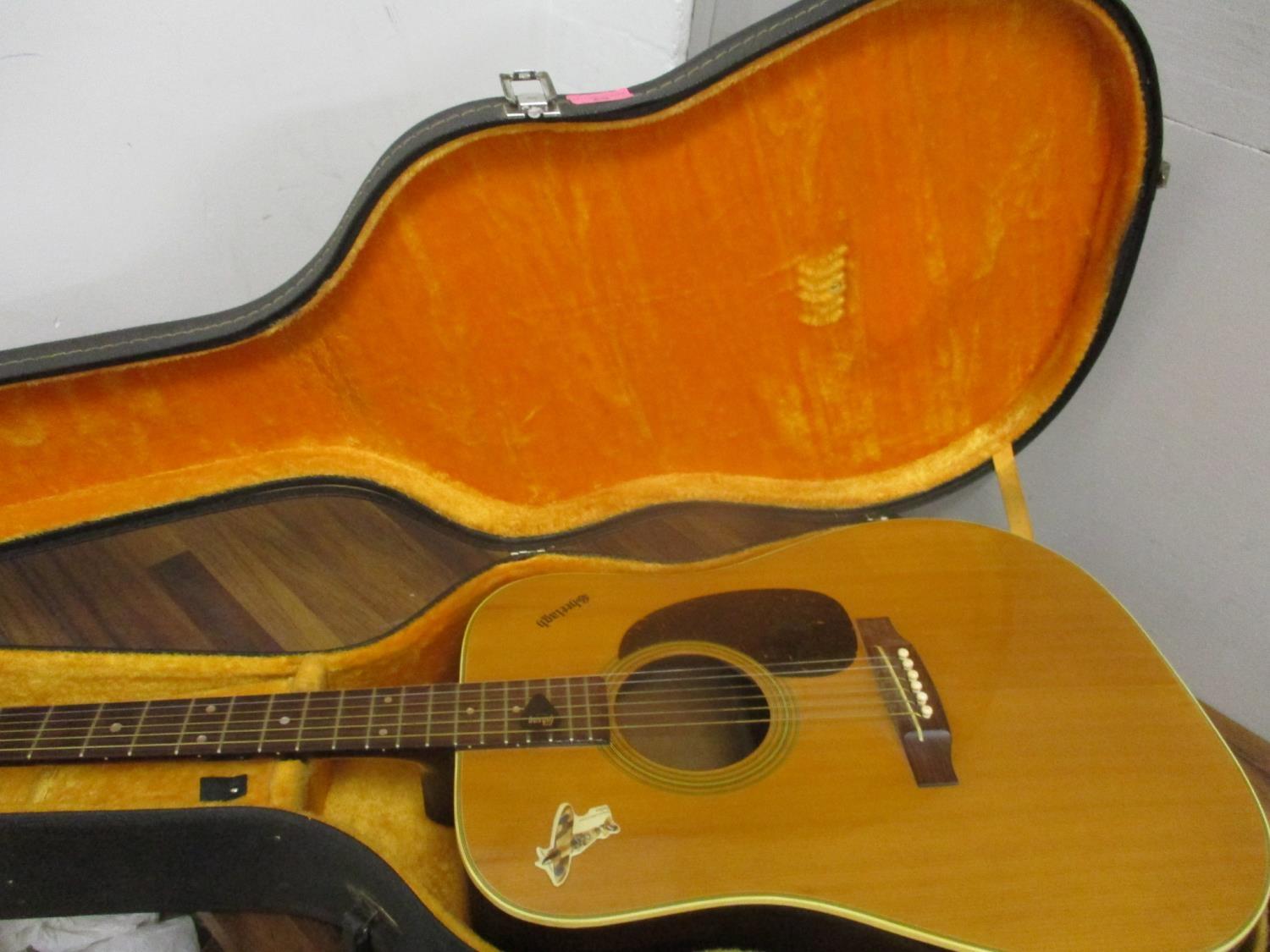 A retro Shelagh Jumbo 155 acoustic guitar, together with a music stand and a hard case