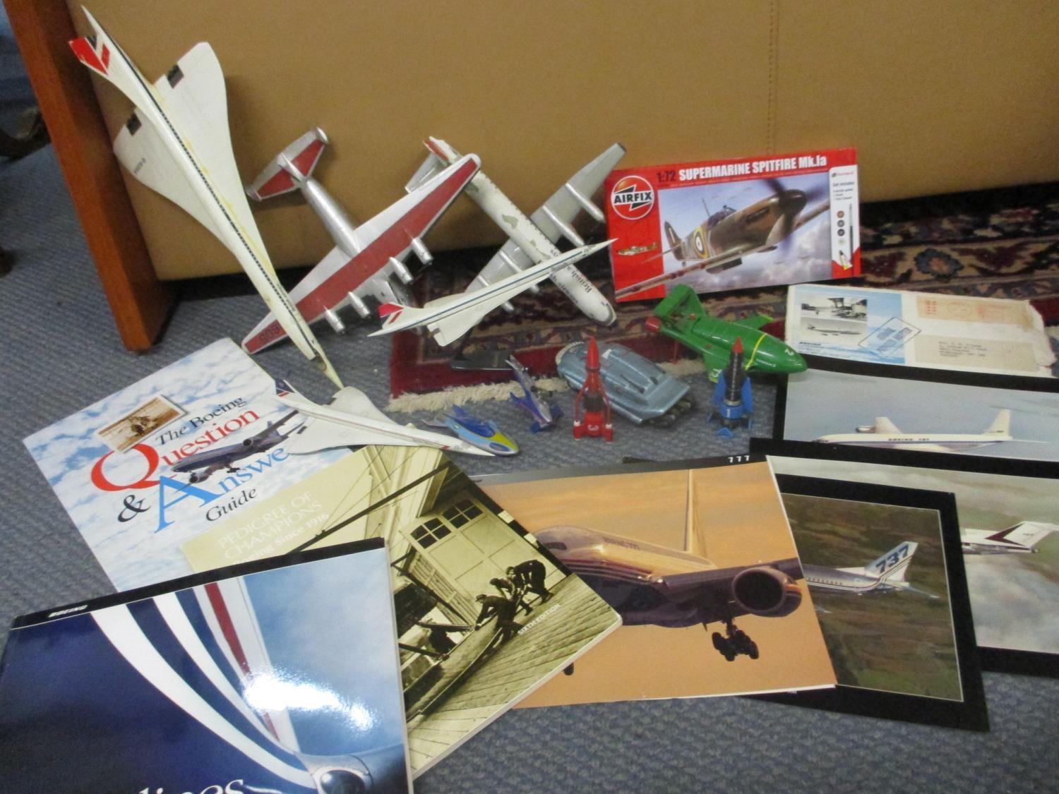 A selection of 1990s Thunderbird die cast vehicles, Concorde and other display models, aircraft