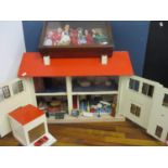 A retro dolls house, retro furniture, a matching garage and a mahogany display case containing seven