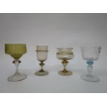 Venetian drinking glasses - to include two with a light brown tint and applied wriggle decoration,