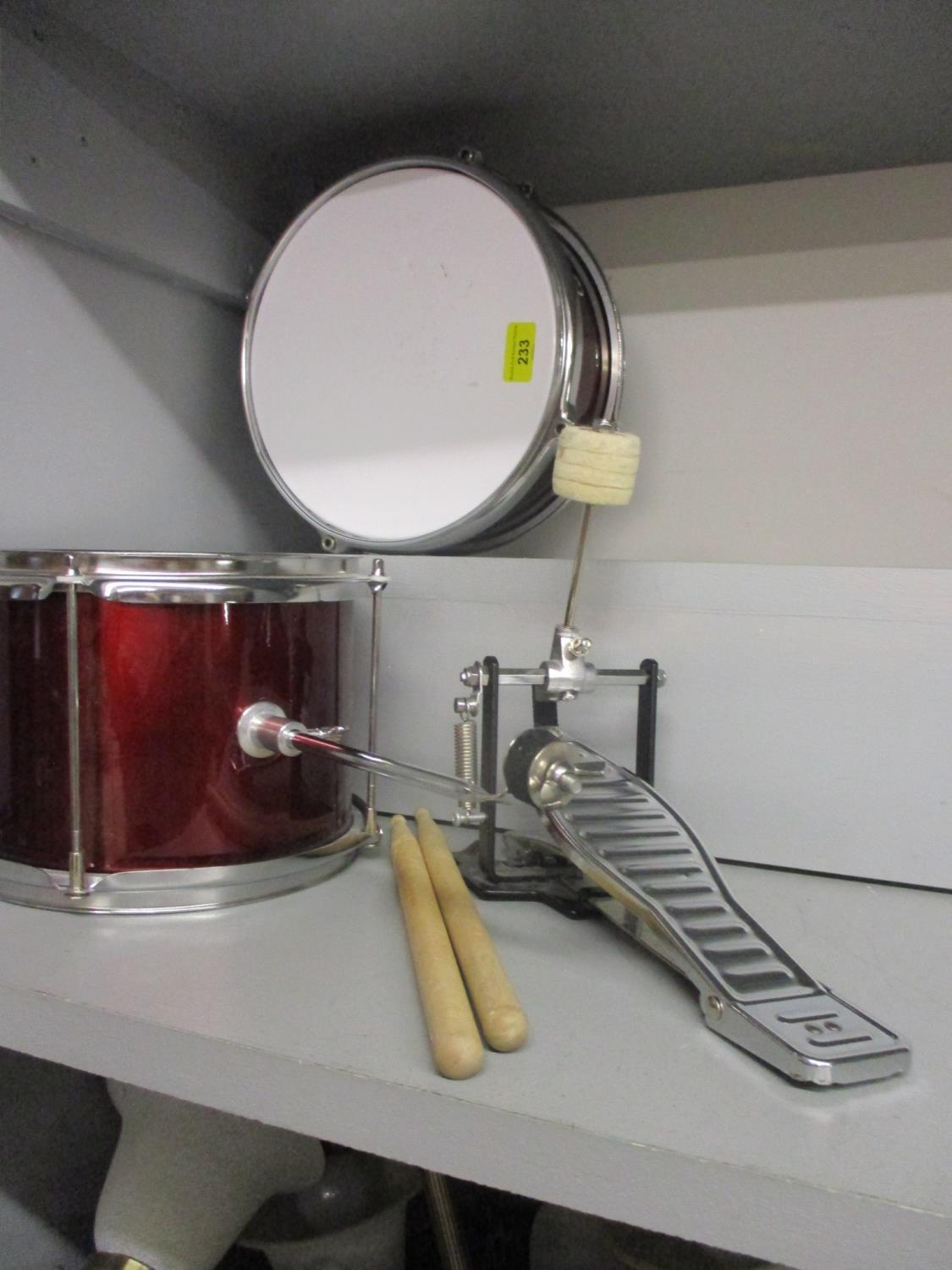 Two small drums and drum sticks, walking sticks and umbrellas