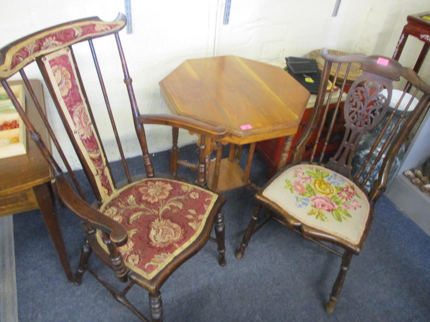 A late Victorian octagonal topped, two tier table, together with two spindle back chairs