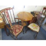 A late Victorian octagonal topped, two tier table, together with two spindle back chairs