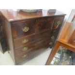 An early 19th century mahogany chest of three short drawers and three long drawers