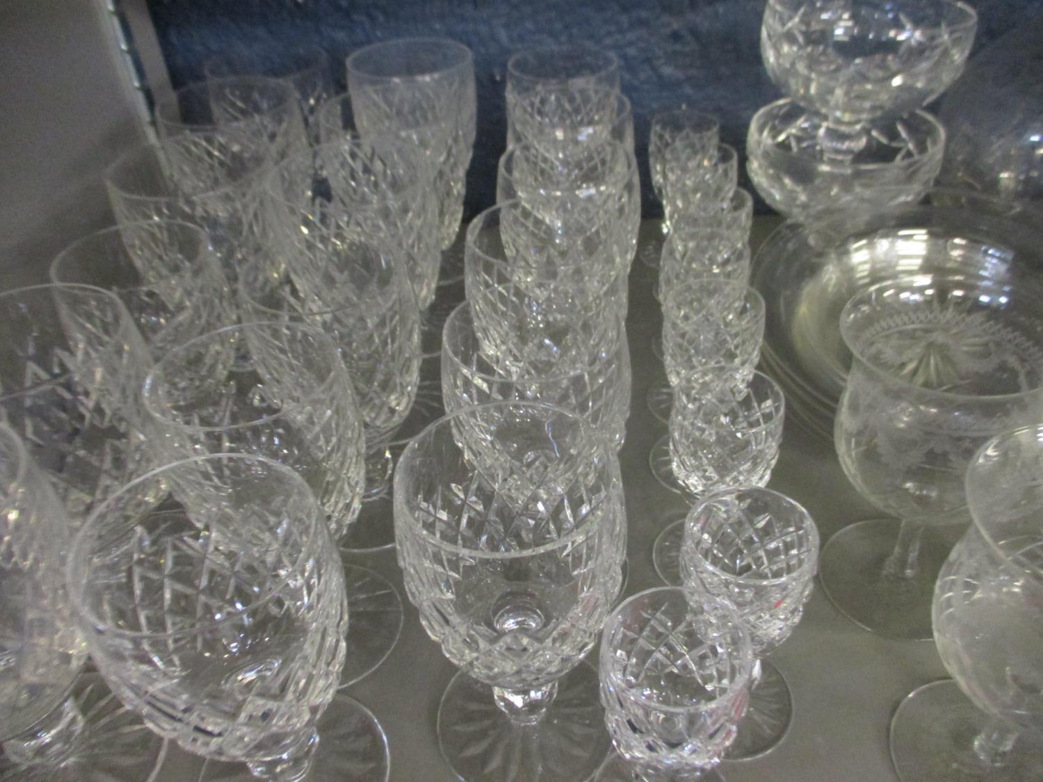 A quantity of Waterford lead crystal glasses, together with early 20th century decanters, etched - Image 2 of 2