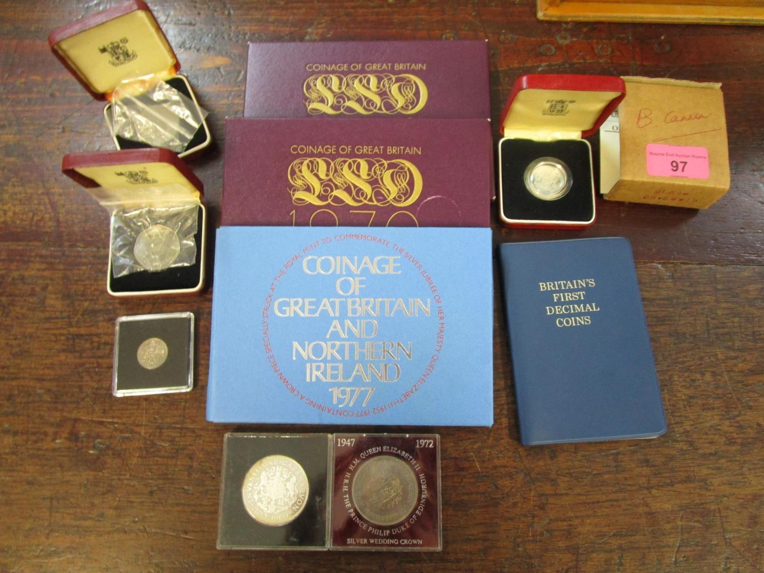 A selection of coins to include a 1983 silver proof coin in a Royal Mint box, a Prince Charles