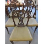 Five 1920s mahogany dining chairs to include one carver