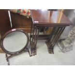 An early 20th century nest of three mahogany tables, together with a dressing table swing mirror