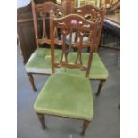 A set of three Arts & Crafts oak splat back dining chairs