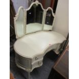 A reproduction French cream painted dressing table having a trifold mirror above drawers 57 3/4"h