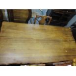 A mid 20th century South African hardwood dining table standing on ball and claw feet, together with