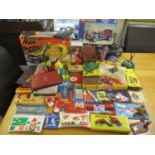 A mixed lot of toys to include an Action Man machine, toy soldiers, pencil cases and others