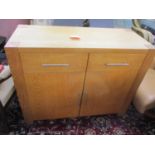 A modern light oak sideboard having two short drawers and cupboard doors, 33 1/2" h x 42 1/2"w