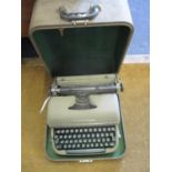 A vintage Remington Miracle Tab typewriter in case