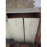 Two reproduction French cream painted wardrobes standing on short cabriole legs