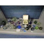 A mixed lot of glass paperweights to include Caithness glass, Mdina, Phoenician glass, Wedgwood,