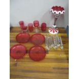 Cranberry glassware to include a lustre vase, a set of four dishes, two tumblers, a jug, a