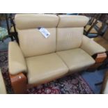A pair of Stressles two seater Pegassus Art Deco style recliner sofas upholstered in Palma leather