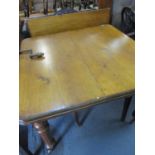 A Victorian mahogany extending dinning table with winder