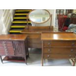 A 1930s mahogany dressing table, together with a mahogany music cabinet and a chest of three long