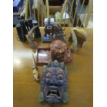 A mixed lot to include a carved elephant match holder, a painted African wooden tribal art face