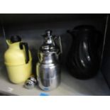 A group of four thermos flasks to include a Connoisserve jug