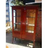 An Edwardian mahogany two door glazed cabinet having string inlay decoration 71"h x 46 1/2"w