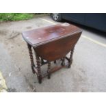 A 1930's oak gate leg table on barley twist legs 29 1/2"H x 29 1/2" W