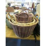 A group of four graduated cane baskets