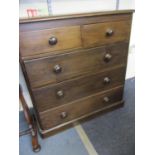 A stained pine chest of drawers with bun handles 38" x 37" x 16"
