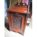 A Victorian walnut coal purdonium having twin handles and carved front panel 27"h x 16"w