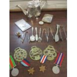 A Defence medal and other WWII medals, silver sugar tongs and mixed silver plate