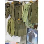 A quantity of WWII and later military clothing A/F to include a 1953 Durigo Manufacturing Company