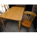 A modern beech kitchen table, on turned legs and a set of six matching lathe back chairs, 29 1/2"
