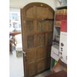 An early 20th century oak door with earlier carved panels 84"h x 41 1/2"w