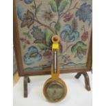 A maple cased barometer and a firescreen